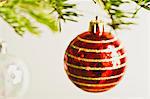 Christmas baubles hanging from Christmas tree, out of focus