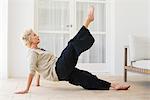 Mature woman practicing pilates