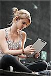 Teenage Girl Listening to iPad, Mannheim, Baden-Wurttemberg, Germany