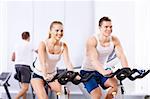 Young people on bikes in a fitness club