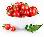 fresh tomatoes in the platekbcn with green leaves isolated on white background