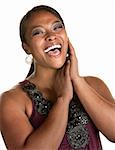 Cheerful Black woman with hands by her face laughing