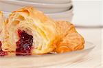 fresh baked croissant French brioche filled with berries jam