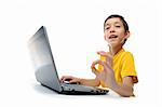young boy in yellow t-shirt with laptop showing ok at camera isolated on white background