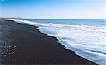 Sea, black sand, pebbles on the south coast of Iceland
