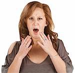 Scared woman with hands near face over white background