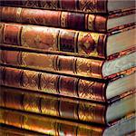 Heap of vintage books with golden touch