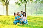 Asian family portrait at outdoor park