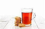 hot tea with cookies on wooden table