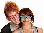 Cute young couple in red and blue glasses over white