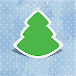 Cute Christmas tree on blue retro background with polka dots