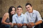 Joyful Native American family sitting together indoors