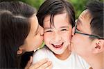 happy asian family in kissing