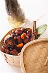 Spice chicken with mushrooms in a bamboo steamer (China)