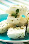 Blocks of Greek Feta Cheese with Dried Oregano on a Blue Plate