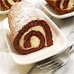 Individual Cream Filled Pumpkin Roll Dusted with Powdered Sugar