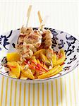 Chicken kebabs with mango salad and cardamom
