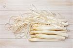 Peeled white asparagus and asparagus peelings