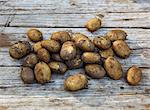 Potatoes on wooden background