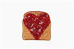 Slice of Bread with Peanut Butter and a Jelly Heart; White Background