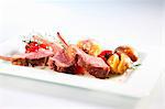 Lamb chops with roast potatoes and cherry tomatoes