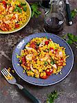 Paella made with chicken, prawns and chorizo