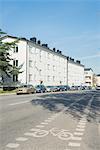 Cars parked in front of block of flats