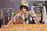 Portrait of an African American female fashion designer working on a pattern cloth