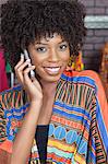 Portrait of an African American female fashion designer on phone call