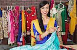 Portrait of an Indian female dressmaker working at design studio