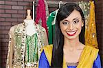 Portrait of a beautiful Indian female dressmaker smiling