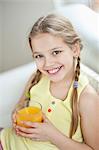 Portrait of girl drinking orange juice