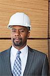 Portrait of an African American male engineer with wooden planks in background