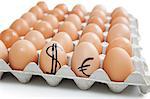 Brown eggs in carton with dollar and euro sign over white background