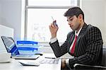 An Indian businessman working at office desk