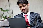 An Indian businessman using tablet PC