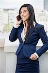 Young Indian businesswoman using cell phone