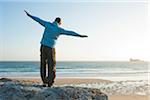 Man with Open Arms at the Beach, Camaret-sur-Mer, Crozon Peninsula, Finistere, Brittany, France