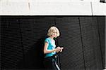 Girl Holding Tablet in Playground, Mannheim, Baden-Wurttemberg, Germany