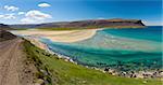 Extremly beautiful bay with mighty golden beaches and turquise sea in the West Fjords, Iceland. Panoramic photo
