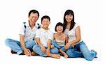 Fullbody happy Asian family sitting on white background