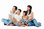Happy Asian family looking at side, sitting on white background