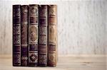 Row of leather vintage books on shelf