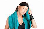 Woman resting and cleaning up her face after a fitness workout