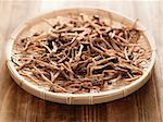 close up of a basket of dried daylily on table