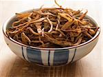 close up of a bowl of dried daylily on table