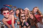 Mixed group of young girls outside blowing bubbles