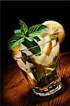 Mojito cocktail on rustic wooden background