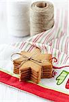 Gingerbread cookies on tea towel; kitchen twin in background