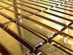Gold ingots stacked in neat rows.